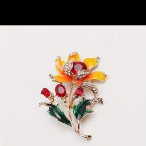 Elegant Floral Brooch with Red and Yellow Accents